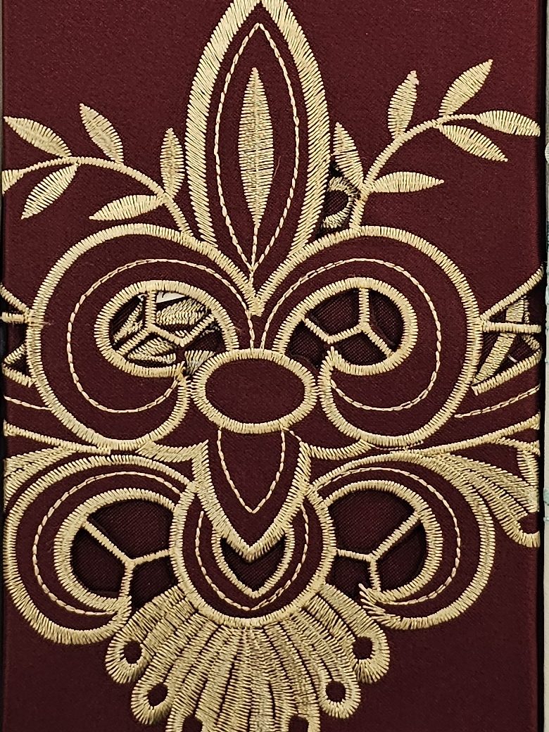 Burgundy guest towel with gold cutwork fleur-de-lis embroidery
